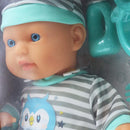 Muñeca 13" bebé con pijama gris y set de alimentación