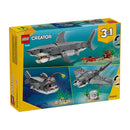 tiburón feroz con cofre del tesoro 31381 creator